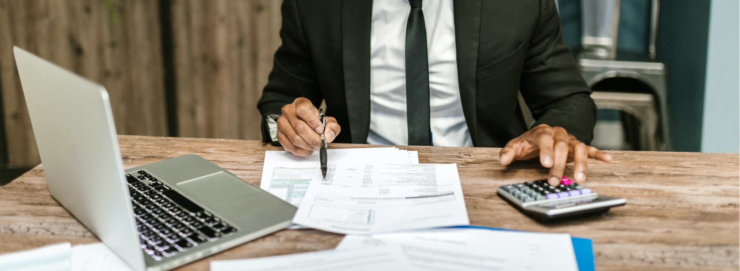 accountant doing paperwork to showcase The Key Role of an Accountant for Limited Companies: Driving Growth and Achieving Success